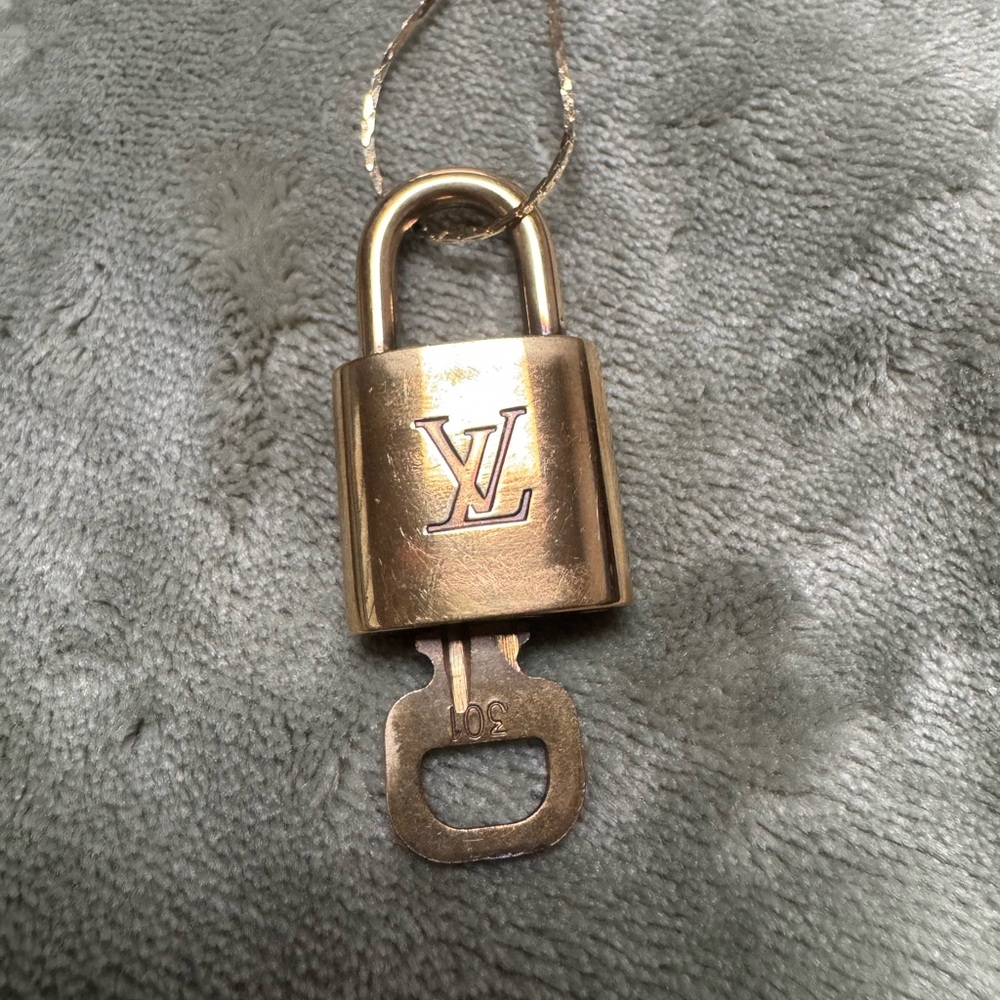 Louis Vuitton lock and key #301 on a gold chain